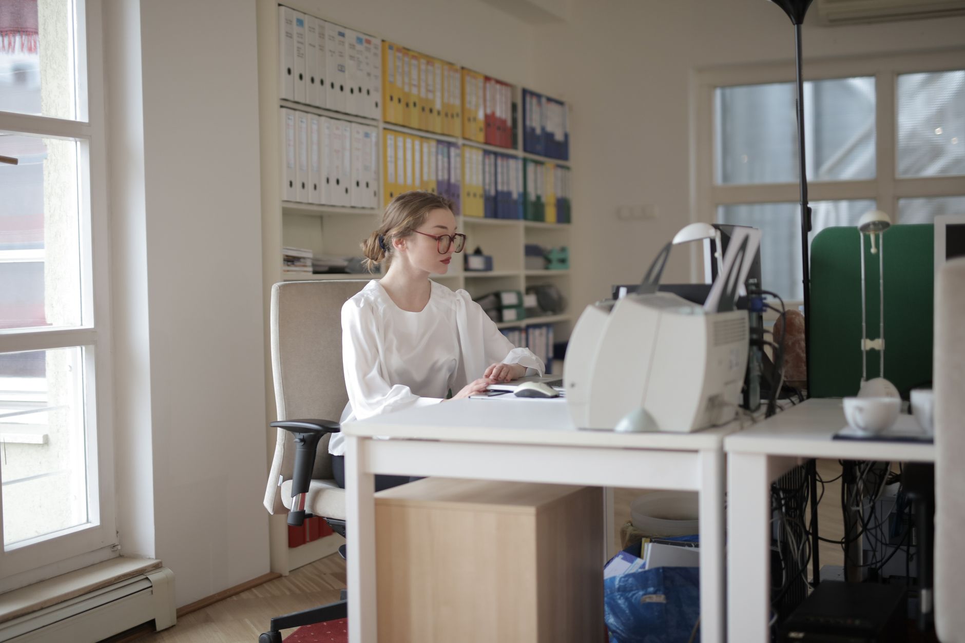 Freelancer home desk with financial reports