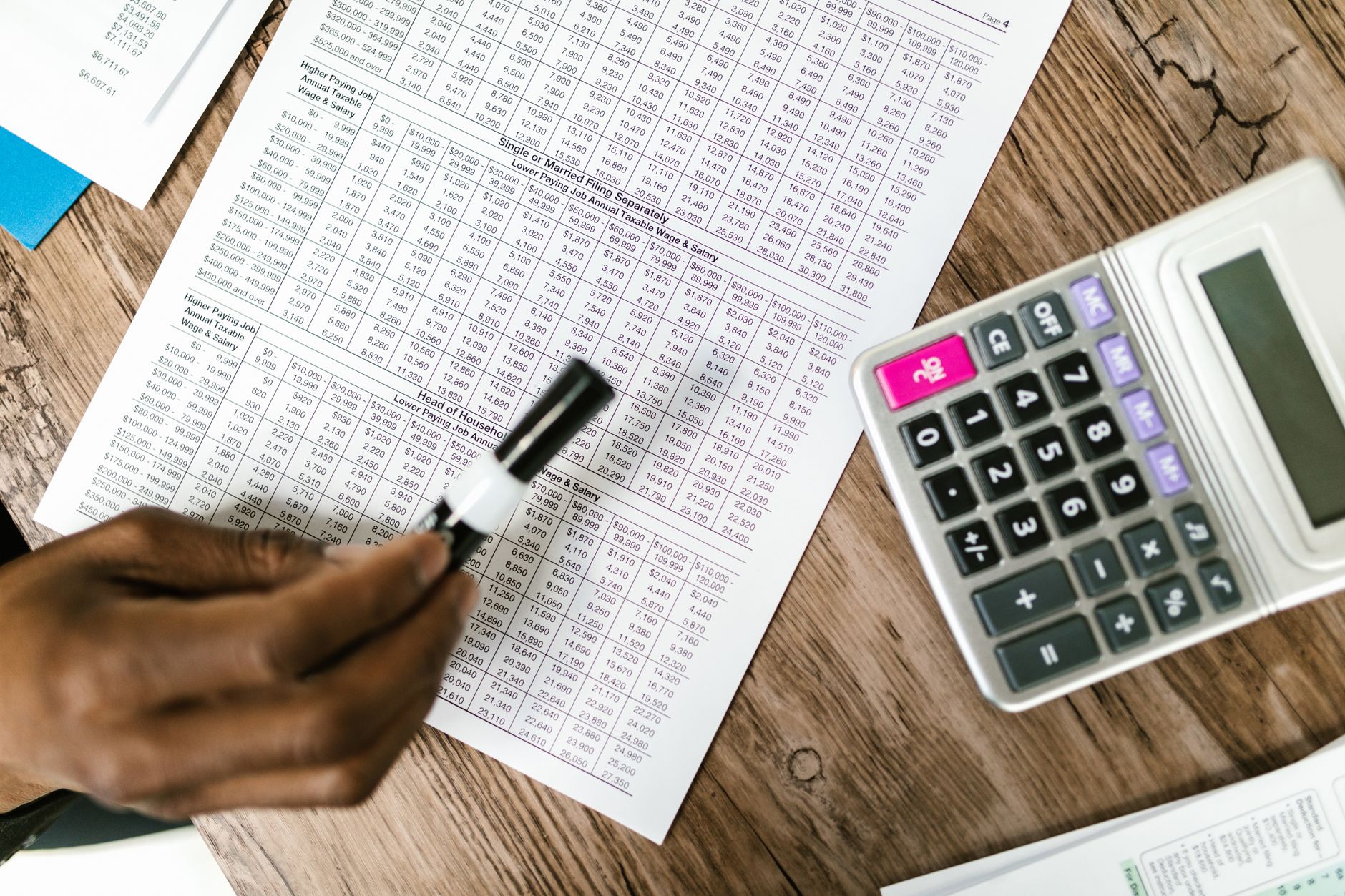 Laptop displaying financial tracking tables